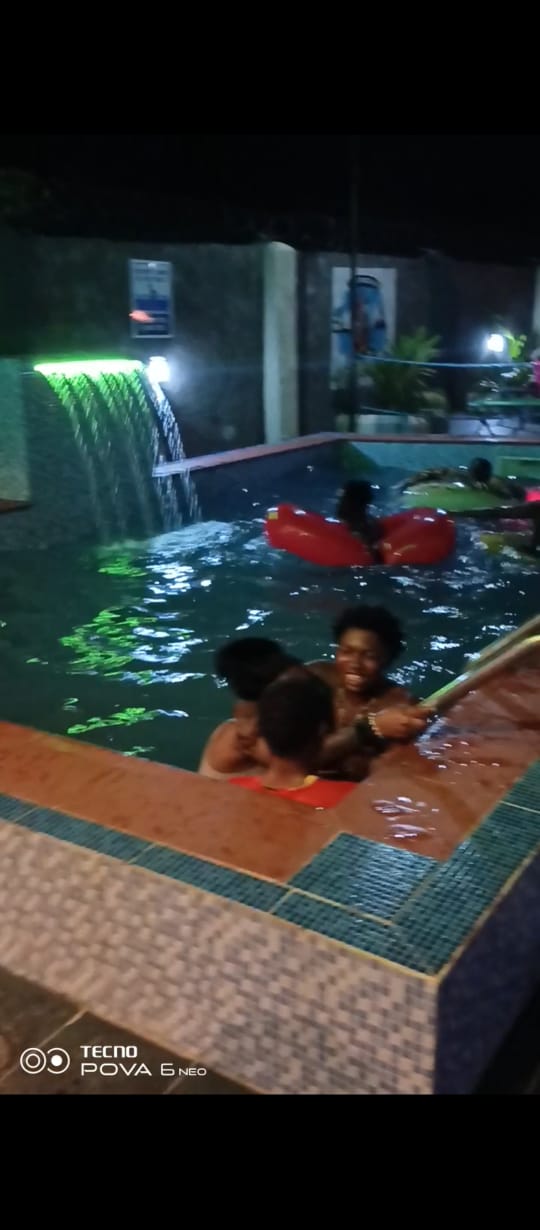 Night Pool with Waterfall